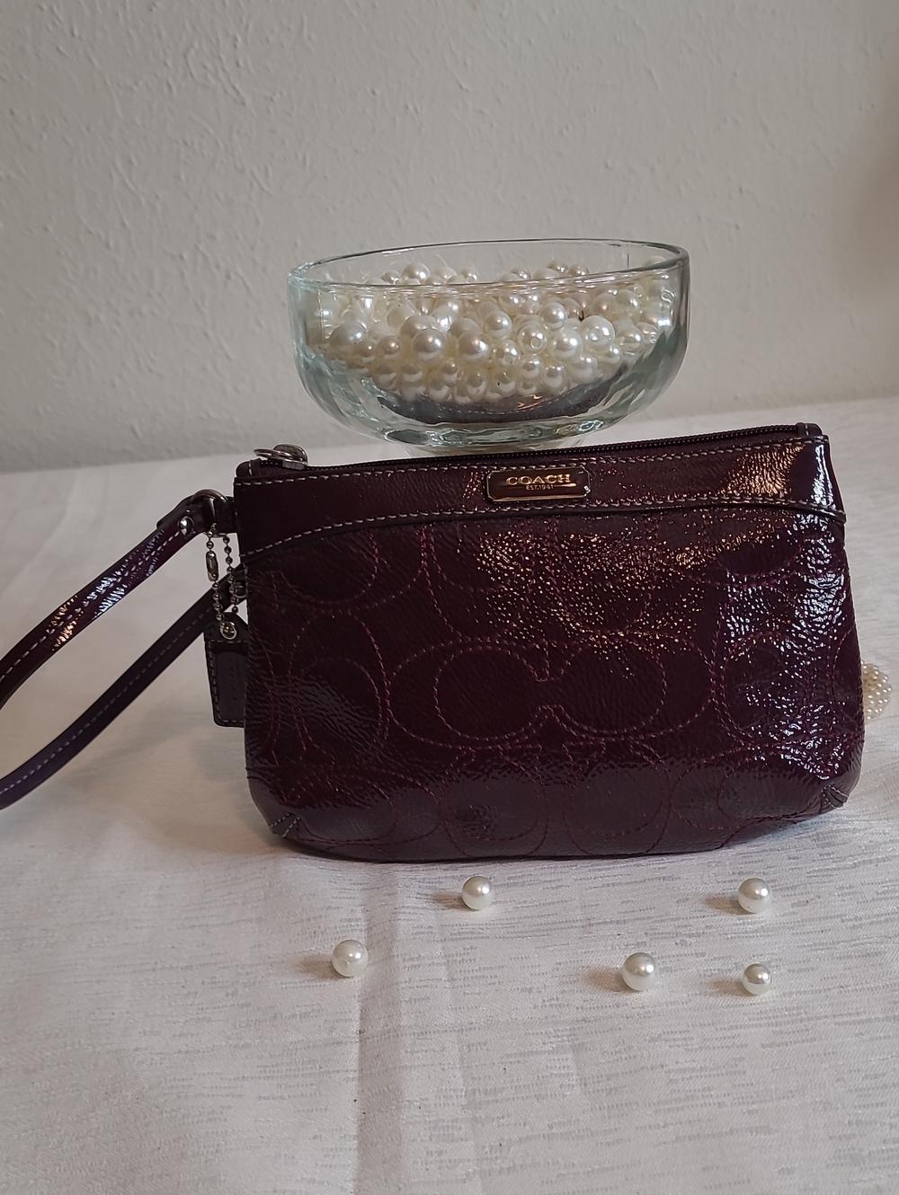 Coach Patent Leather Wristlet in Deep Plum with hang tag. Excellent condition
